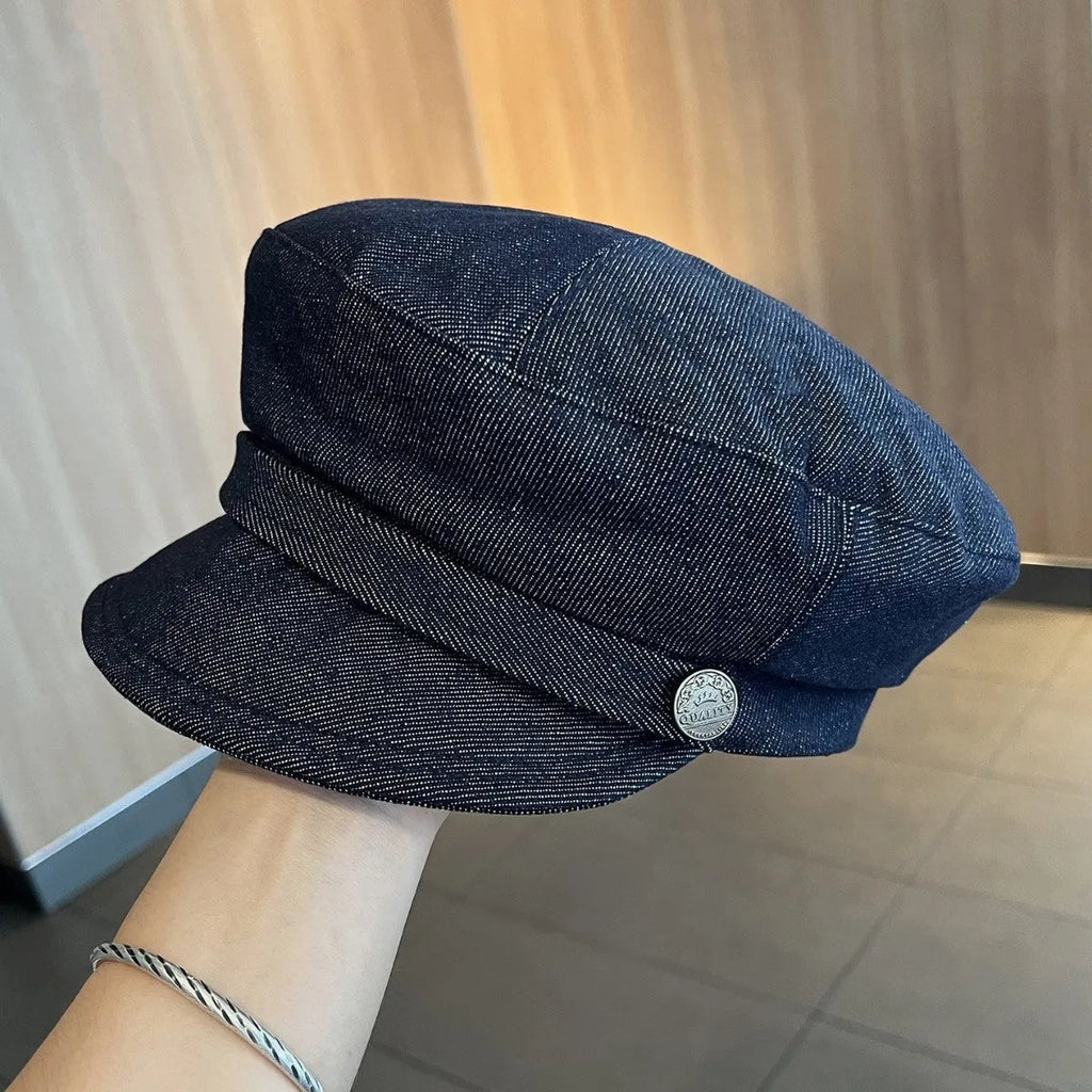 Dark blue denim newsboy hat with octagonal crown and contrasting brim