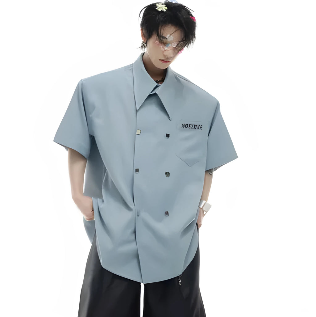 Man's loose-fit casual short-sleeve shirt with lapel collar in blue, showing splicing and button decoration details.
