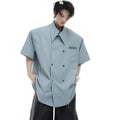 Man's loose-fit casual short-sleeve shirt with lapel collar in blue, showing splicing and button decoration details.