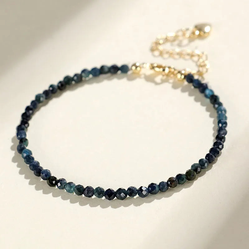 Close-up of a blue tourmaline and spacer bead bracelet for women.