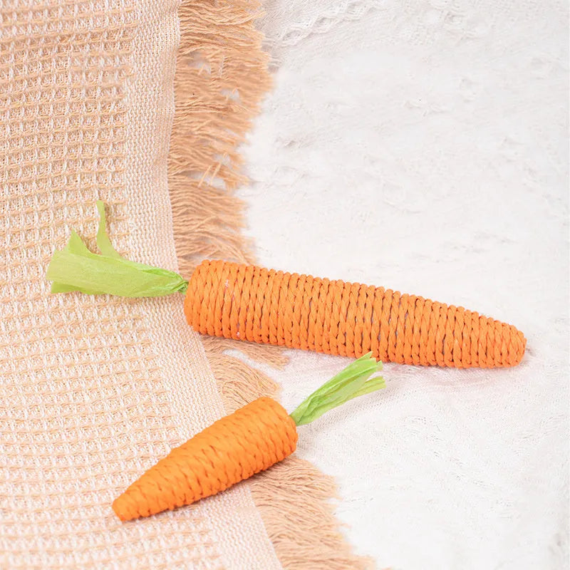 Interactive cat toys set with carrot-shaped bites, paper rolls, ringing stones, feather sticks, and dental grinding sticks