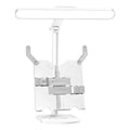 Adjustable reading bookshelf lamp with three colour temperature settings on a desk