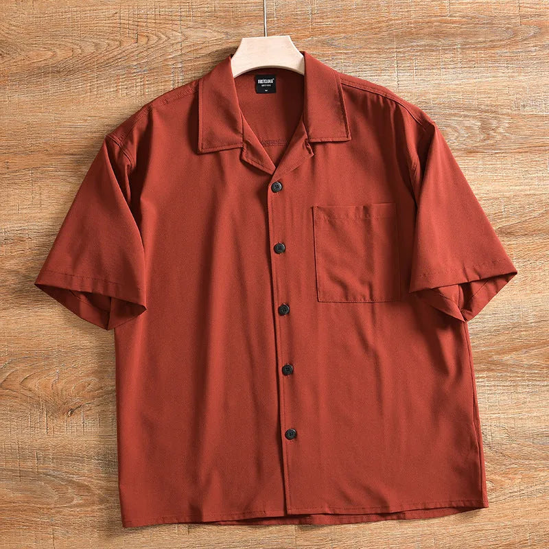 Men's loose fit lightweight short sleeve shirt in a solid colour, showing front design.