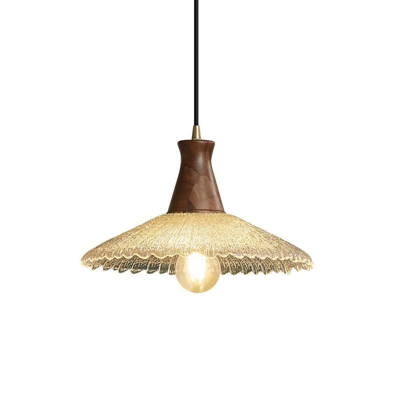 Retro wooden ceiling lamp with brass details and glass shade shown in a dining setting