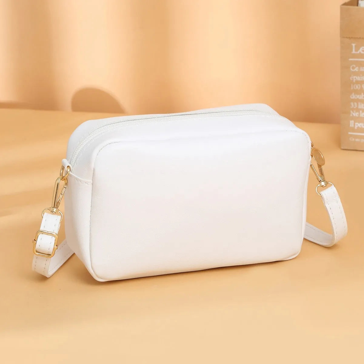Women's solid colour PU shoulder bag with three-dimensional pocket in urban simplicity style