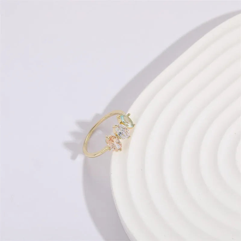 Geometric triangle birthstone ring with horse eye tricolour zircon in gold electroplated finish