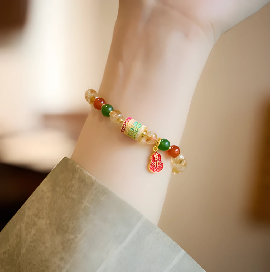 Hand-woven citrine crystal bracelet with 6mm geometric beads on a wrist