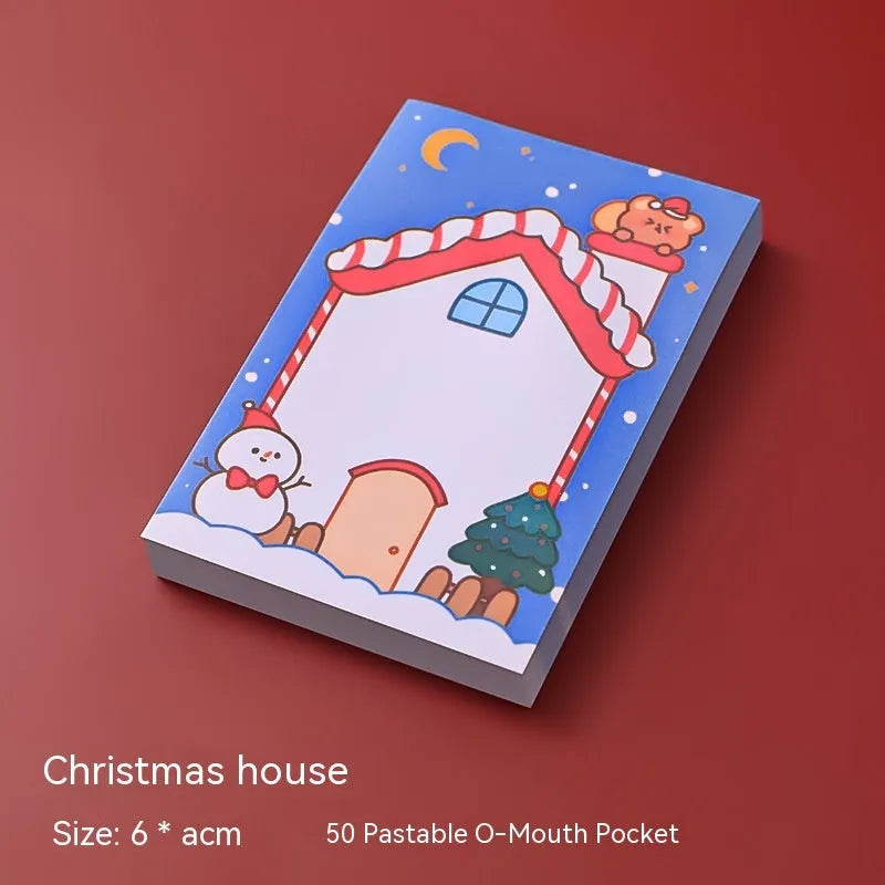 Christmas cartoon sticky notes pad with festive designs including Santa Claus and snowman
