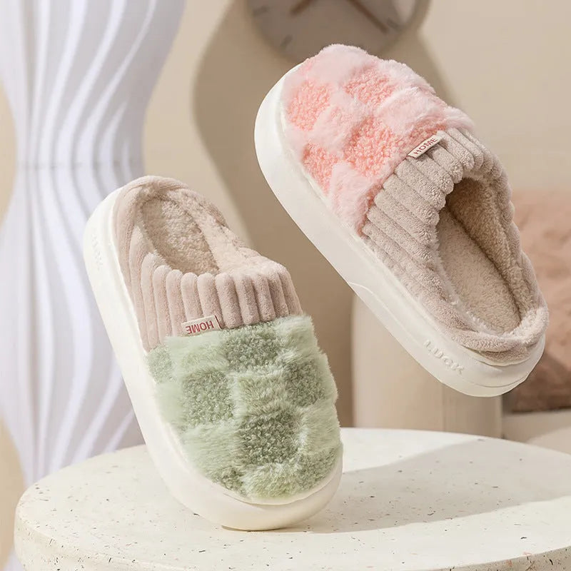 Women's plaid patterned plush slippers with a non-slip PVC sole, shown in a selection of colours including coffee, green, and pink.