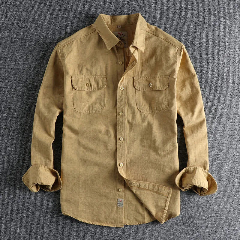 Men's solid colour cotton long sleeve button-down shirt in light blue on hanger