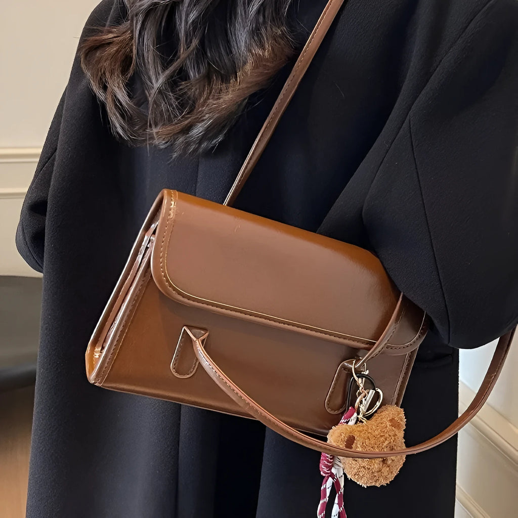 Women's brown PU Maillard shoulder bag with pendant showing horizontal square shape and dual straps