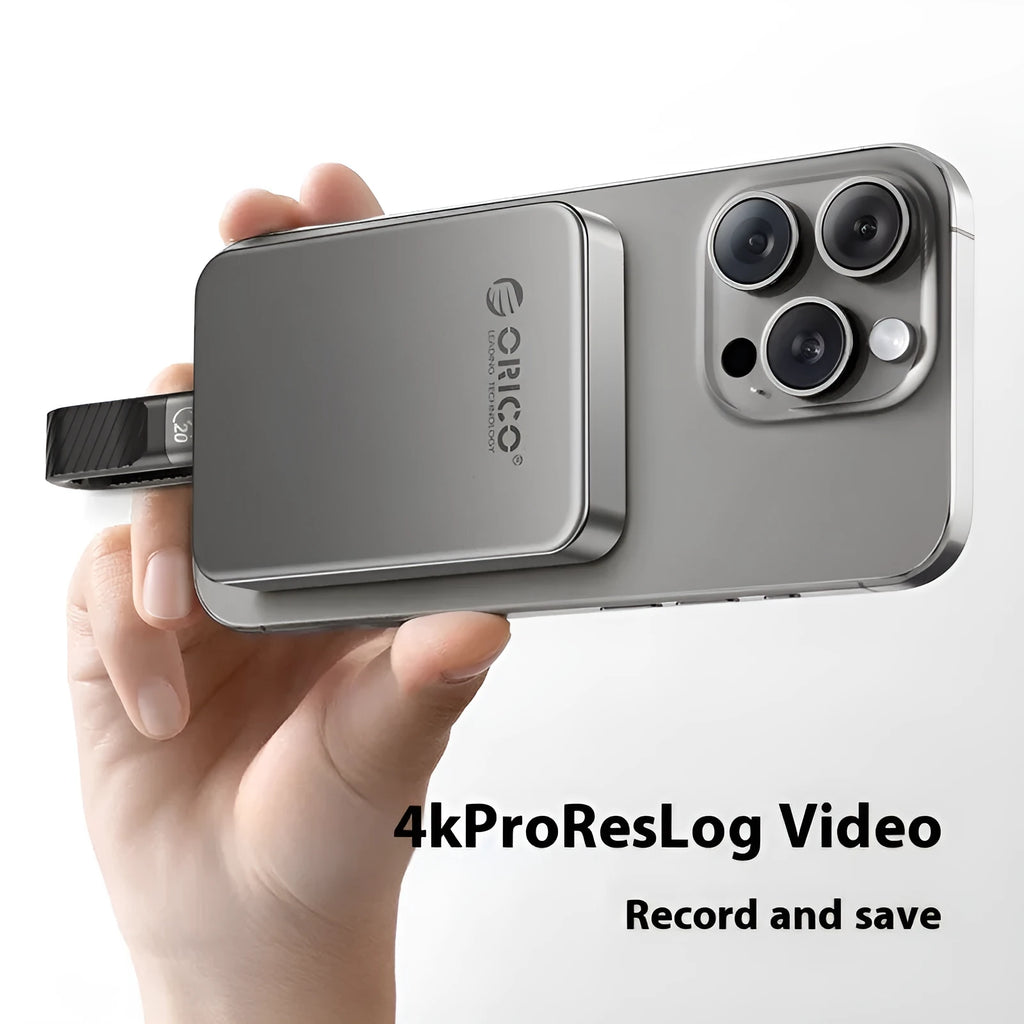 Grey ultra-thin magnetic mobile solid state drive for phones and computers with C to C cable.