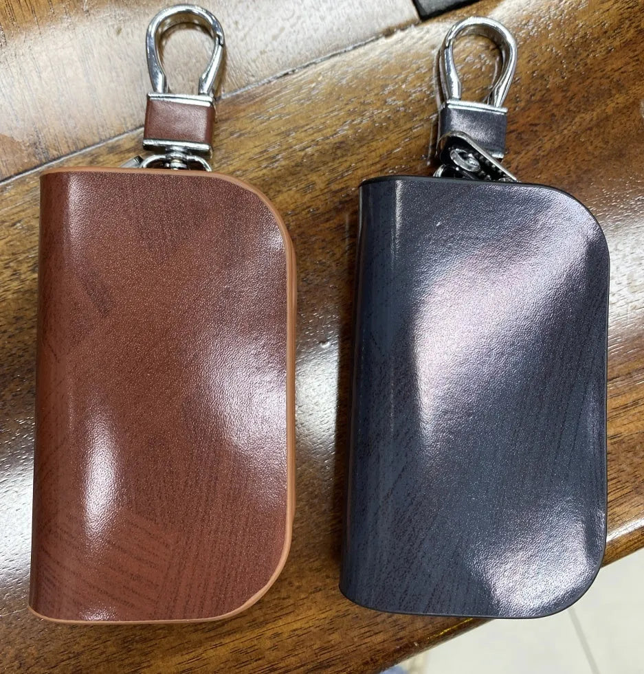 Black and brown genuine leather car key case with zipper closure showing inner dimensions