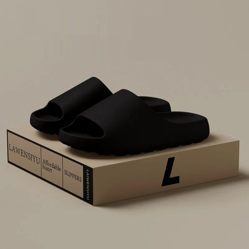Women's thick sole beach slippers in black, green, and brown colours on a plain background