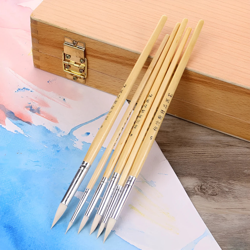 Set of six wooden-handled artistic pen brushes with pointed wool bristles for calligraphy and detailed painting.