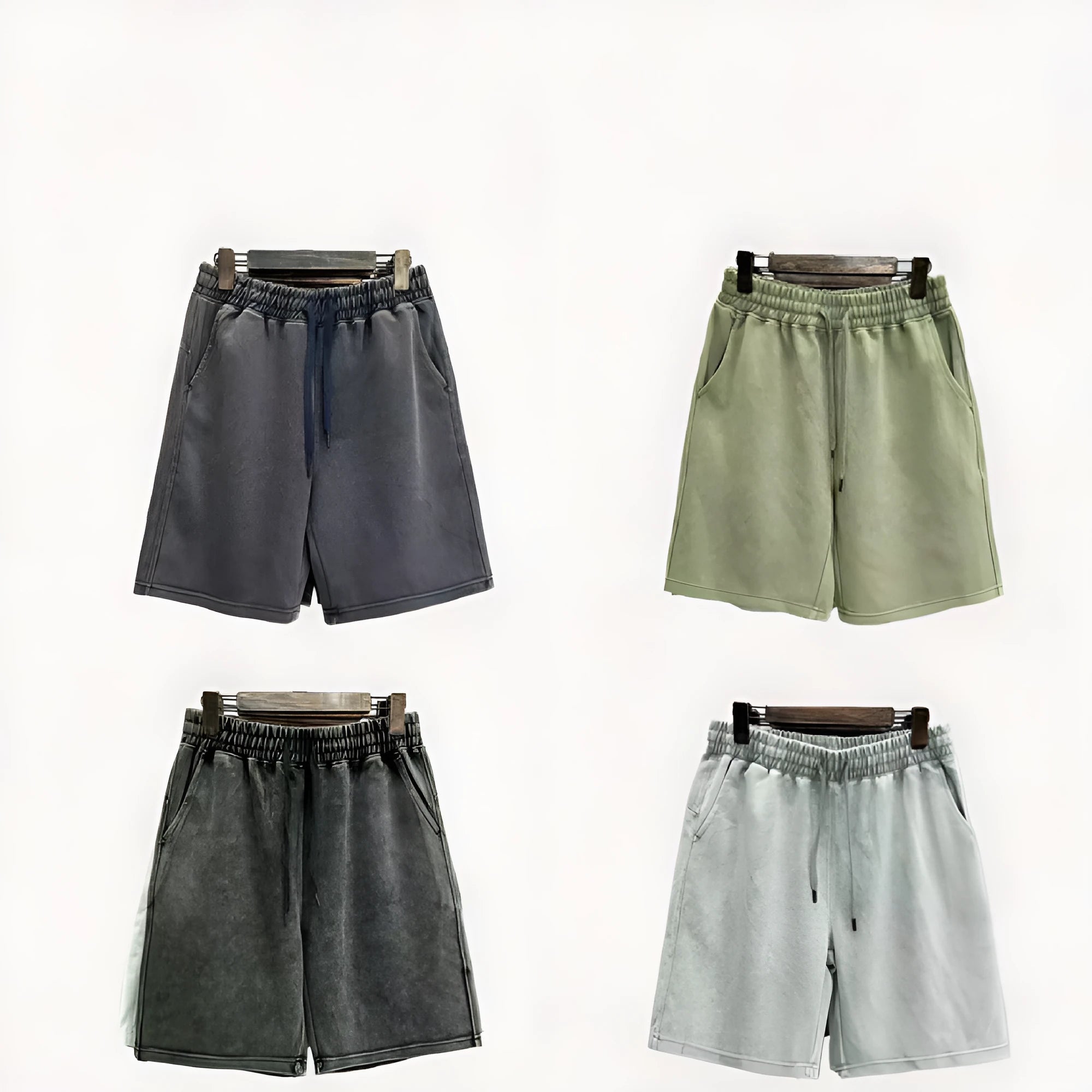 Men's cotton distressed casual shorts in loose straight-leg fit, shown in one of four solid colours.