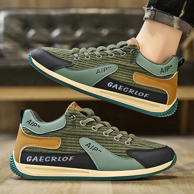 Men's grey and green low-top mesh running shoes with lace-up front.