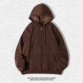 Plus size man wearing a beige zip-up hooded cardigan sweater with kangaroo pockets