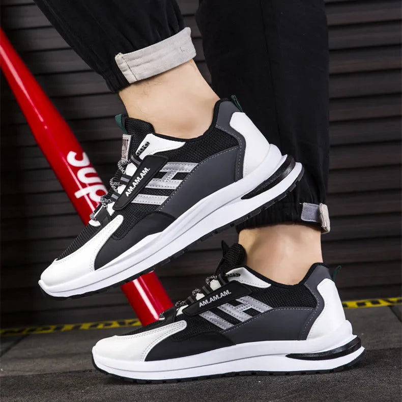 Men's sports sneakers in light grey or black with PU and mesh upper, front tie fastening, plastic sole, sizes 39-44