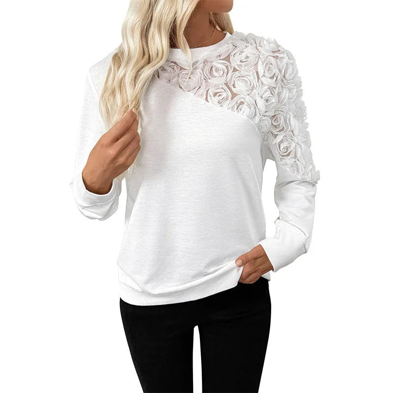 White long sleeve pullover top with floral pattern, loose fit design