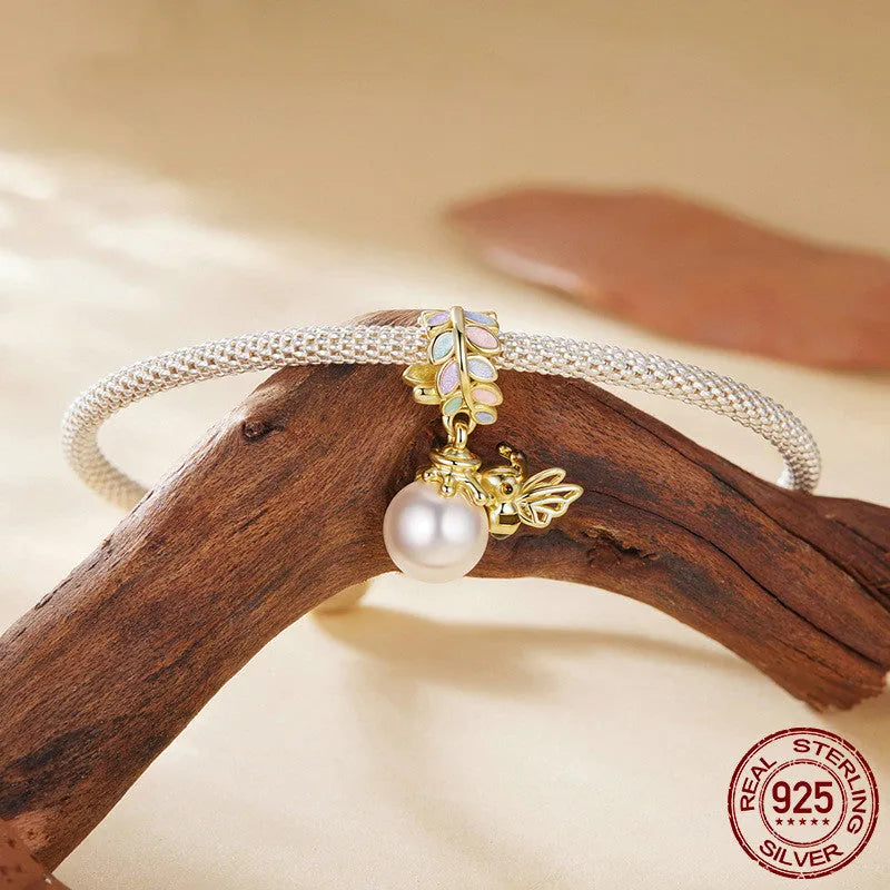 S925 sterling silver gold plated bee pendant with pearl accent, 2.1cm high, 1.4cm wide, 0.45cm aperture