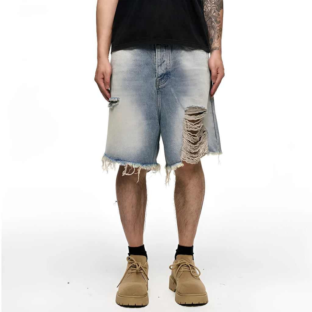 Men's light blue baggy denim shorts on a mid-waist mannequin, showing wide leg cut and zipper fly.