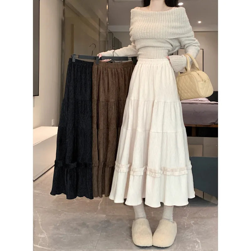 Beige corduroy A-line midi skirt with elastic waistband shown on mannequin