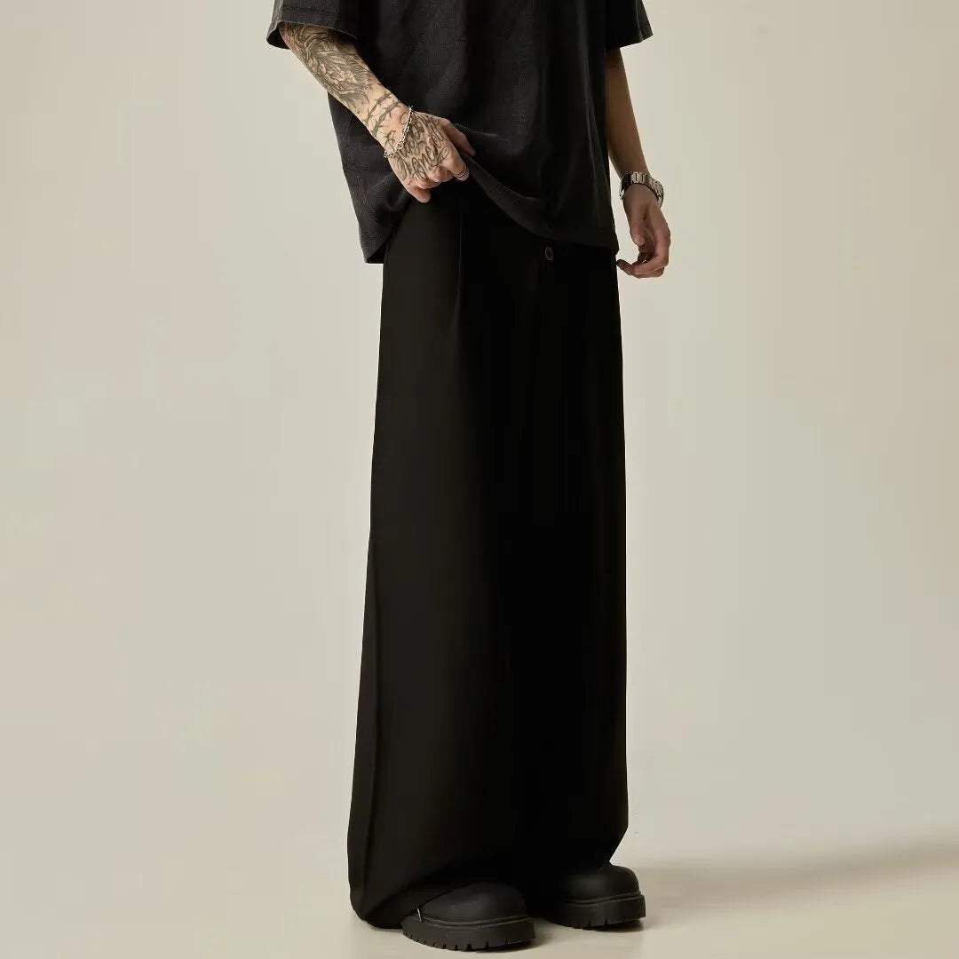 Men's black vertical tube wide-leg trousers showing cotton blend fabric texture and straight-leg silhouette
