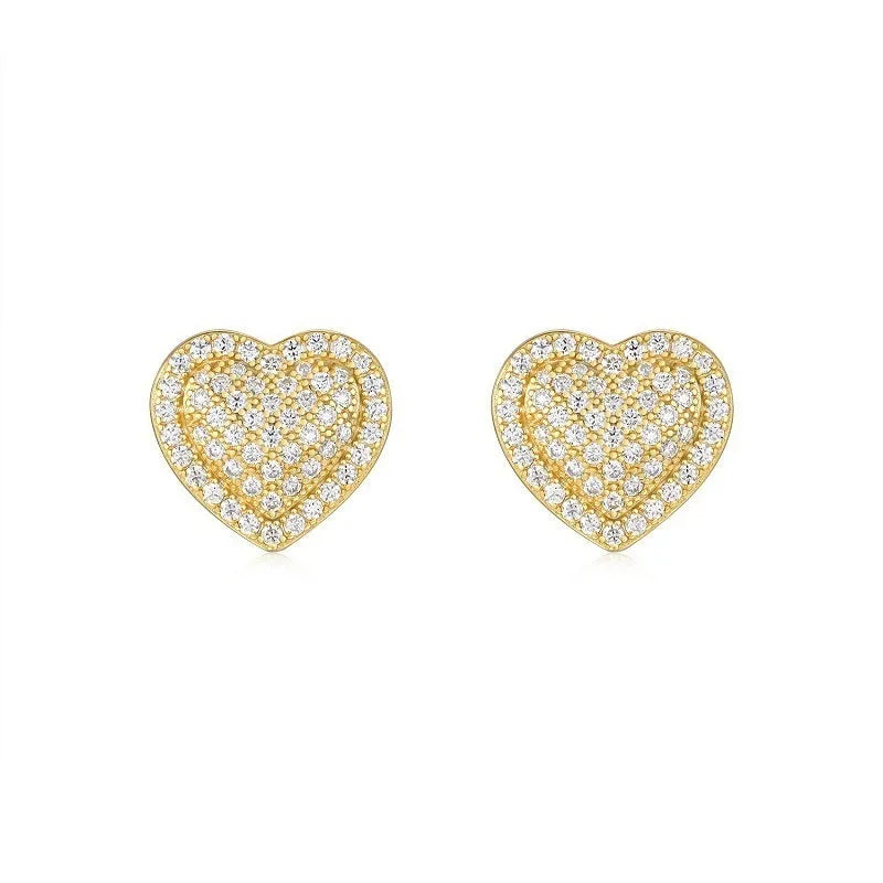 A pair of simple gold-tone heart-shaped stud earrings with a moissanite stone, shown from the front.