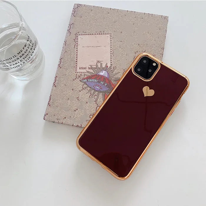 A solid colour TPU back cover case for an iPhone, shown in blue, claret, pink, and green colour options.