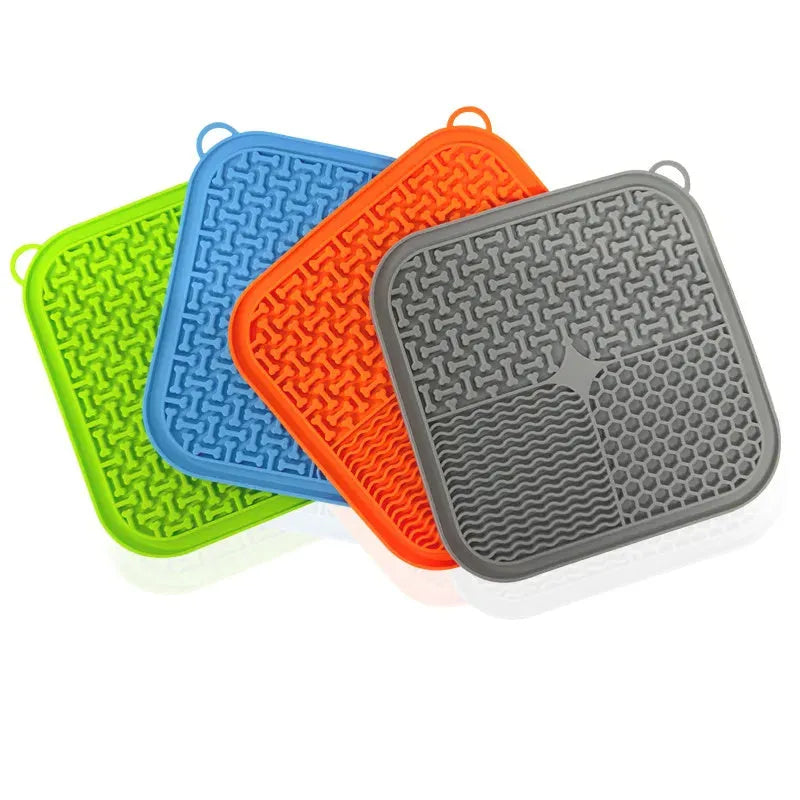 Square silicone dog licking mat with textured surface and suction cups on reverse side