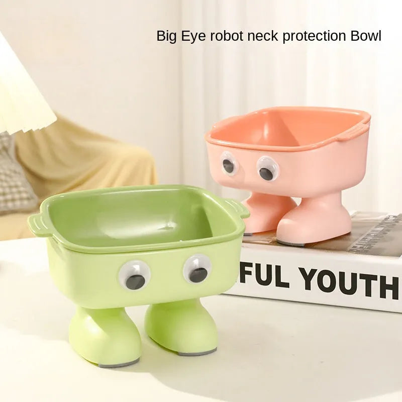 Green cartoon robot shaped elevated cat bowl with a tilted, detachable inner food dish.