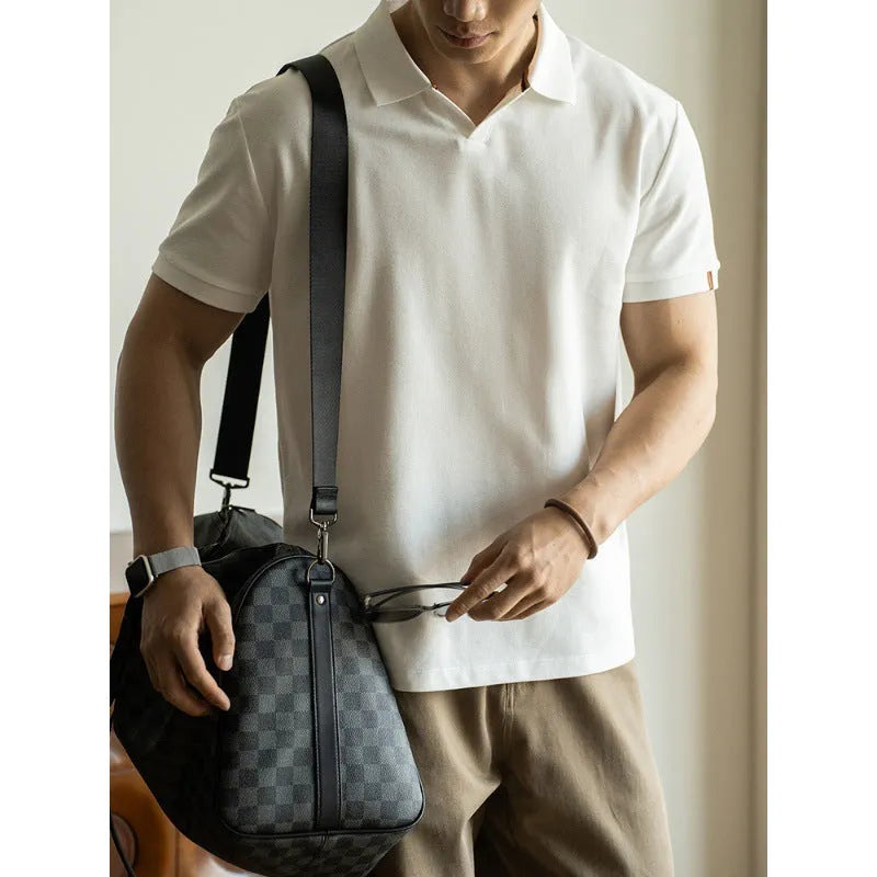 Blue short-sleeved cotton blend polo shirt on a hanger, showing regular fit and button placket.