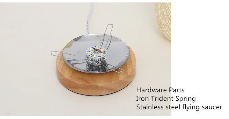 Brown hemp rope desk lamp with spherical shade on circular wood base