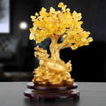Citrine-coloured resin money tree ornament with a small turtle, measuring 18 by 23 cm.