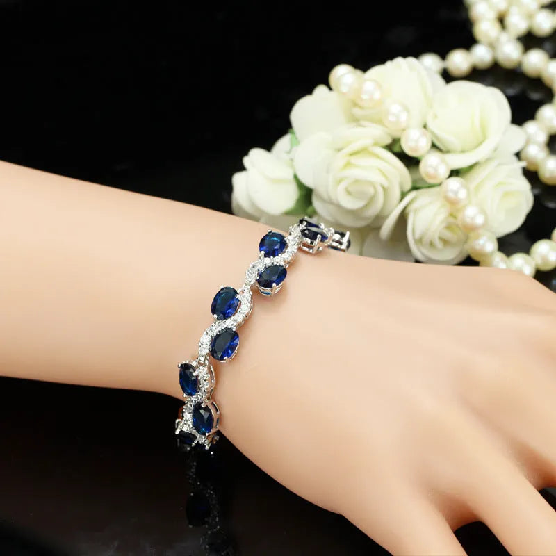 Geometric simple style gold plated bracelet with AAA zircon stones on a white background.