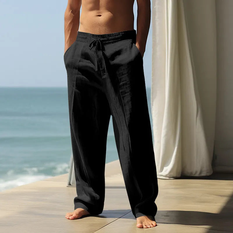 Men's loose fit cotton casual trousers in solid colours including black, grey, and blue options