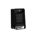 Black desktop electric heater with touch screen display and remote control on wooden desk