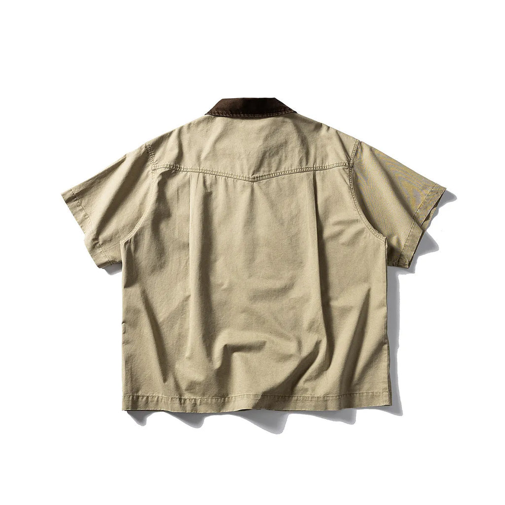 Man's loose-fitting khaki cotton overalls shirt with short sleeves, cardigan style