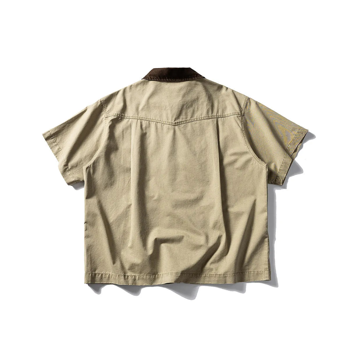 Man's loose-fitting khaki cotton overalls shirt with short sleeves, cardigan style