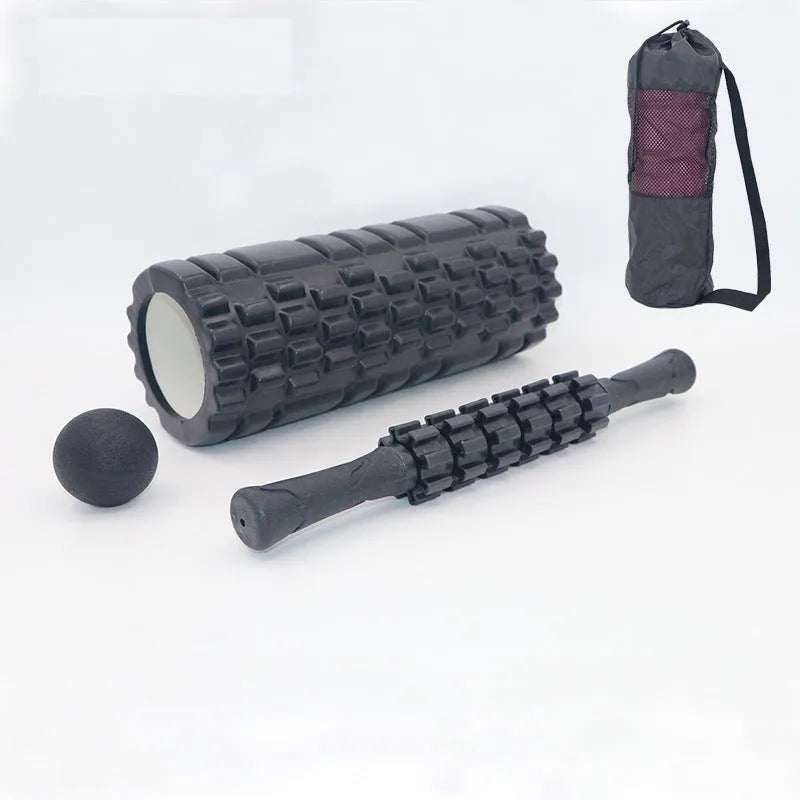 Black foam massage roller measuring 33cm with six separate massage pieces along shaft
