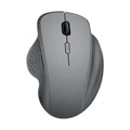 Compact black wireless recharging mouse for laptops with USB cable on a desk.