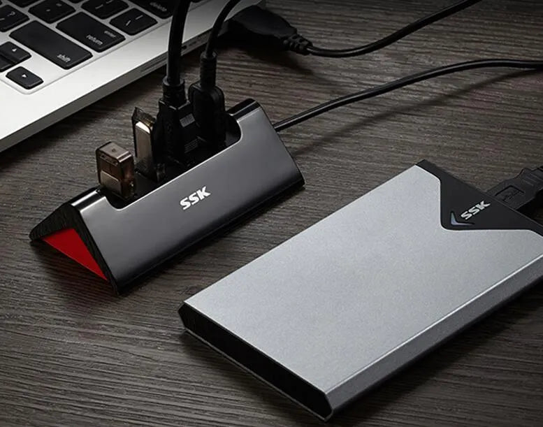 Black USB expansion hub with four ports and a Micro USB power connector.