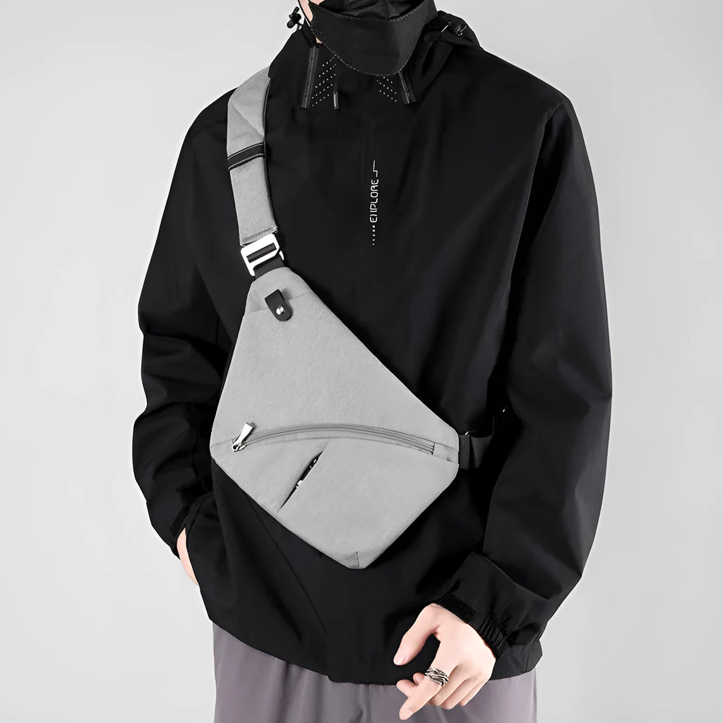 Men's oxford cloth chest bag showing single shoulder strap design in grey and black colour options