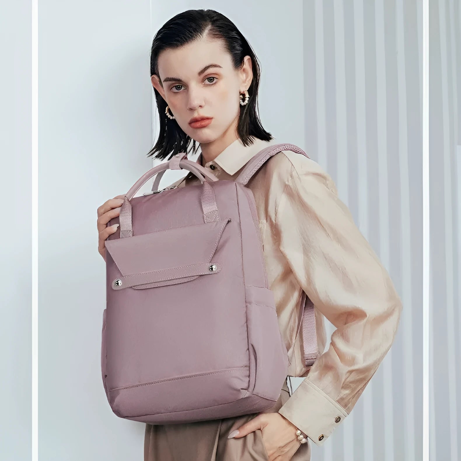Lightweight large capacity schoolbag in solid colour nylon with waterproof finish for girls and travel