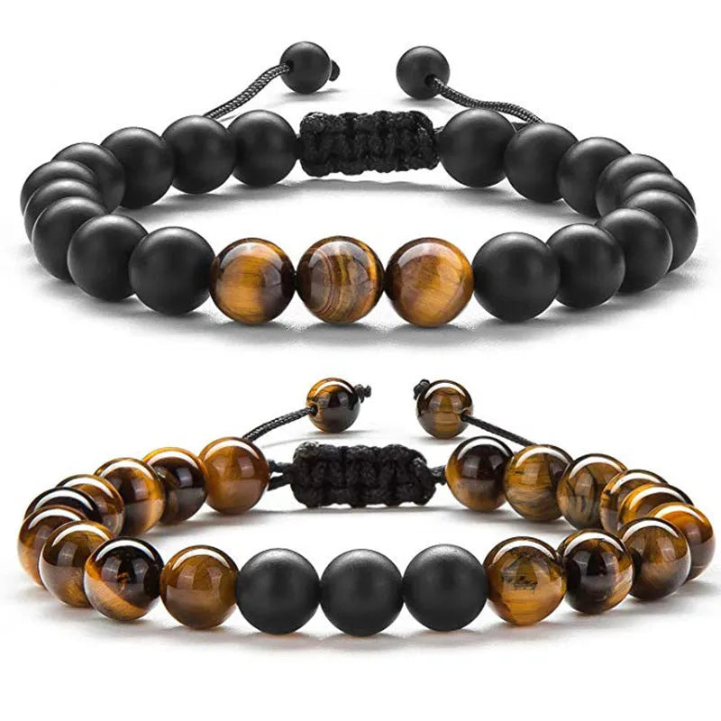 Matte black agate bead couple bracelets with a geometric design on a white background.