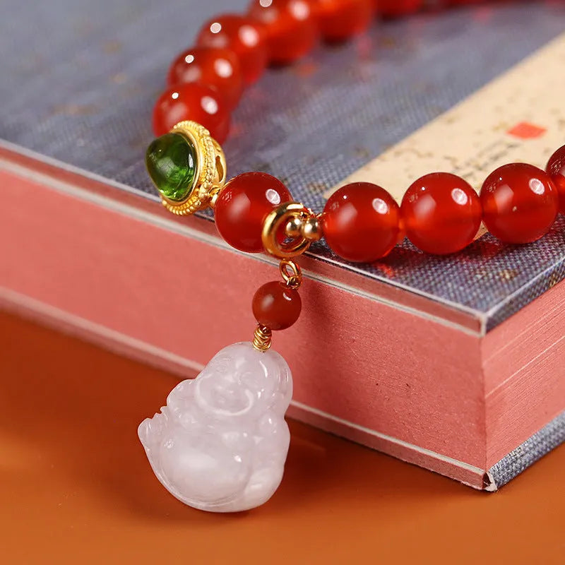 Chinese style women's bracelet with natural amber, red agate beads and gold Buddha charm