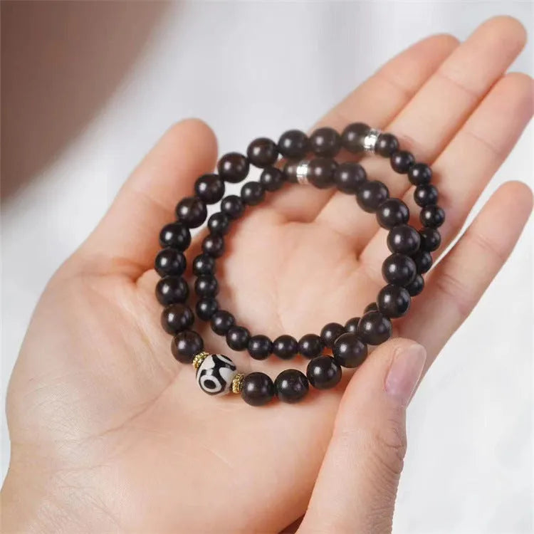 Ebony wood bracelet with 8mm diameter and two circles of beads in retro style