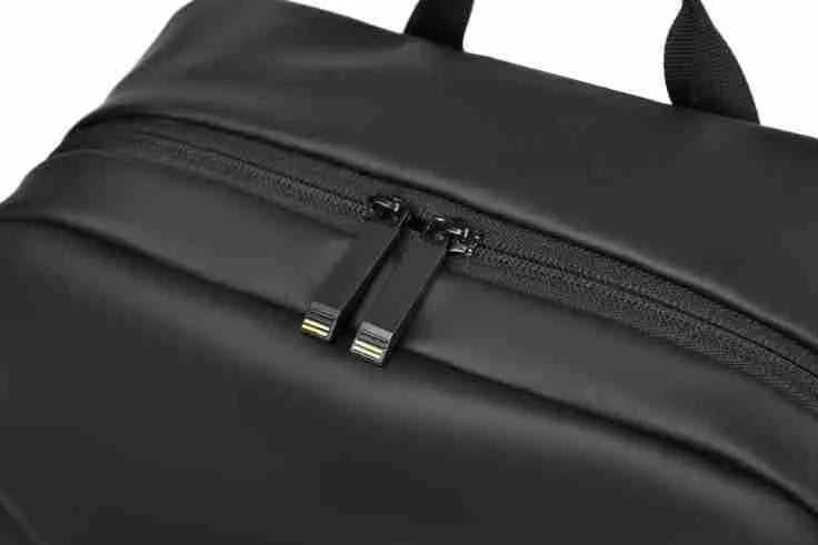 Waterproof PU leather backpack in black with contrast stitching and large capacity design