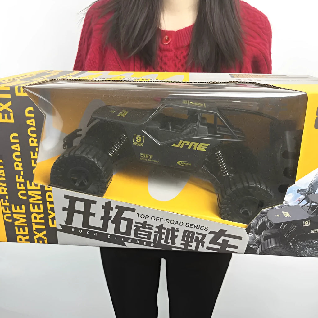 Super large black remote control off-road toy car with electric four-wheel drive and spring rod suspension